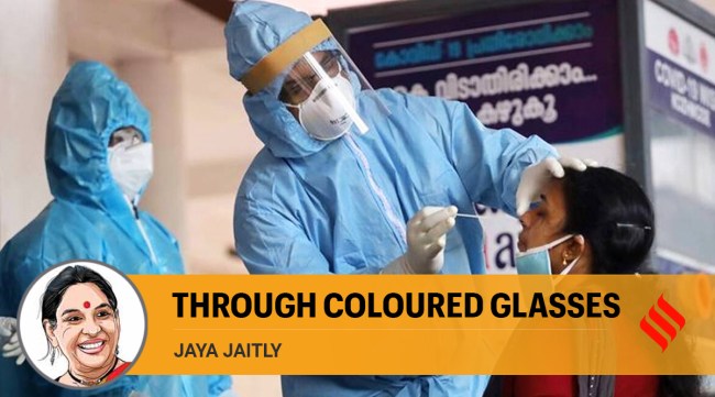 Health workers collect swab sample from a woman for COVID-19 tests, in Kozhikode (PTI)
