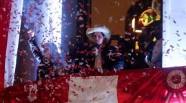 Leftist Pedro Castillo celebrates after Peru's electoral authority announced him as the winner of the presidential election, in Lima