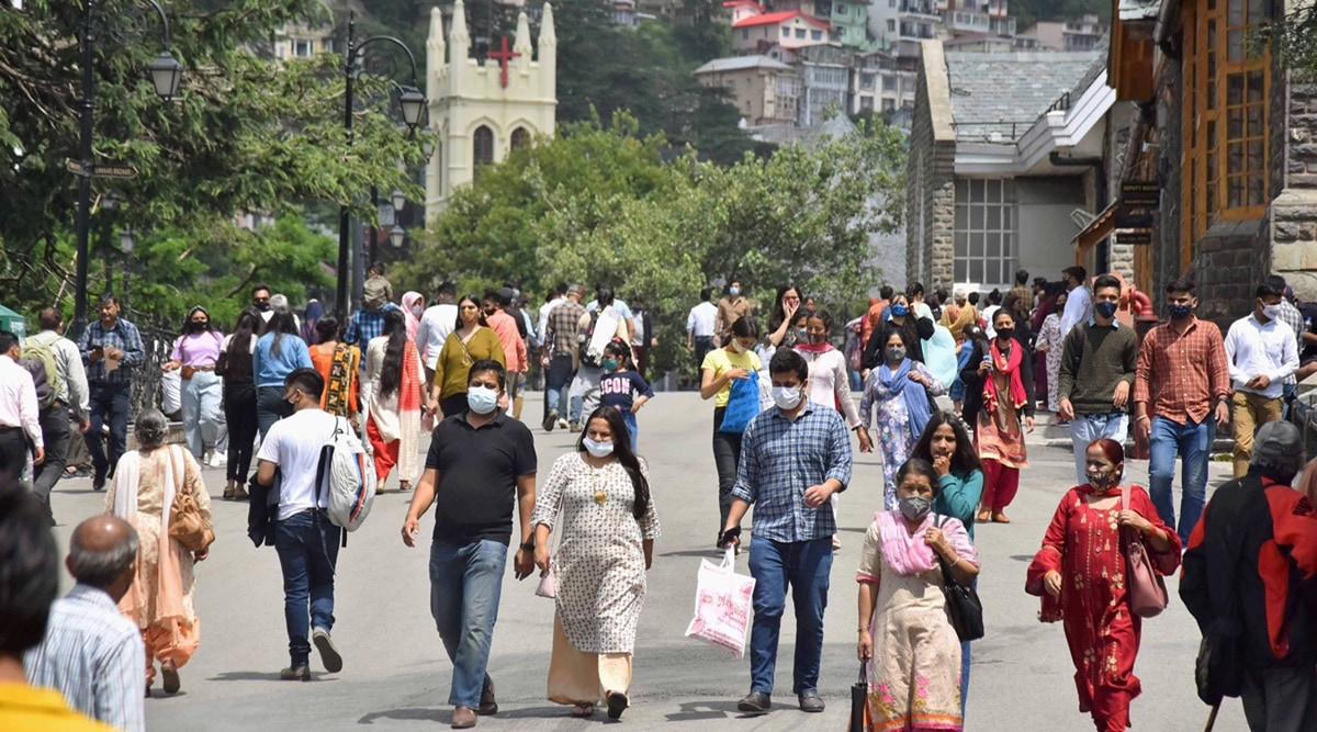 Tourists and locals walk on the Ridge Road following ease in Covid-induced restrictions, in Shimla. (PTI/File Photo)
