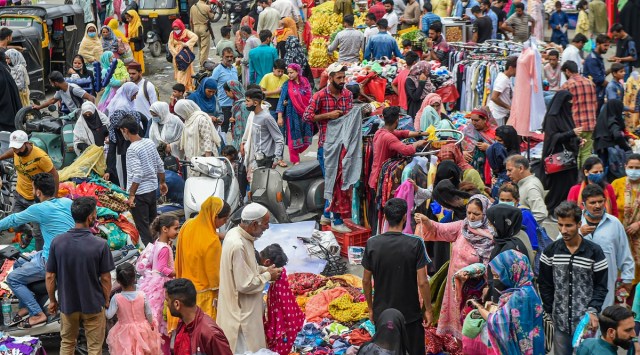 People shop at a market on the eve of Eid-ul-Zuha amidst COVID-19 restrictions, in Srinagar, Monday, July 19, 2021. (PTI Photo/S. Irfan)