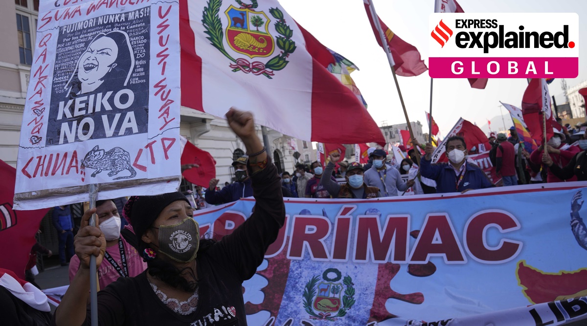 People march in support of presidential candidate Pedro Castillo exactly one month after June 06 presidential elections in Lima, Peru, Tuesday, July 6, 2021. (AP Photo)