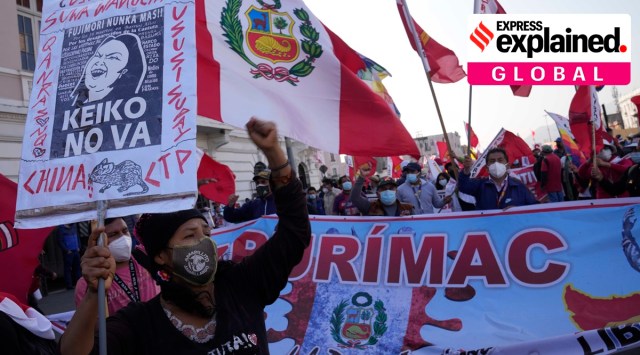 People march in support of presidential candidate Pedro Castillo exactly one month after June 06 presidential elections in Lima, Peru, Tuesday, July 6, 2021. (AP Photo)