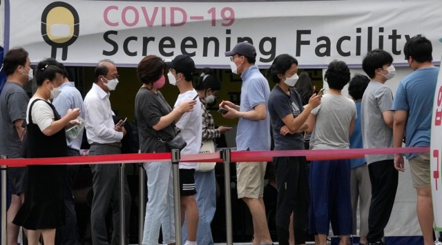 People queue up to get tested for Covid-19 in Seoul on Friday. (Photo: AP)
