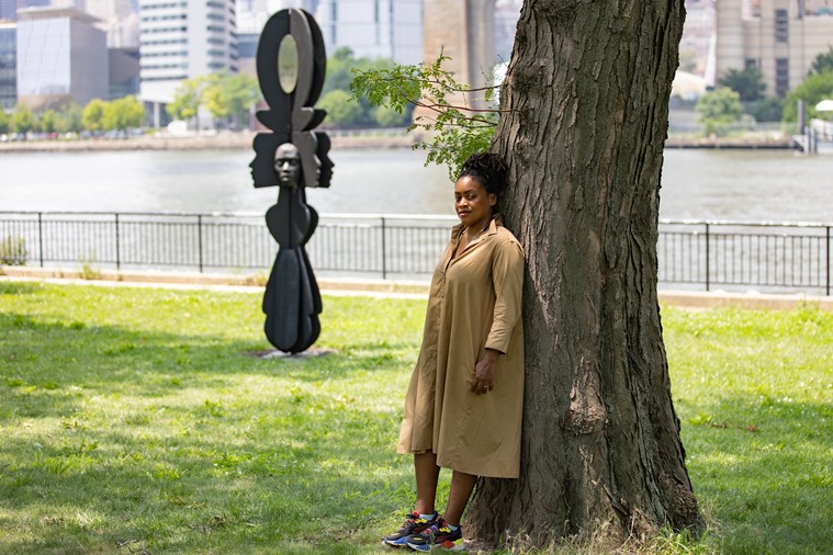 Artist Tanda Francis poses with her sculpture ‘Be Heard’ in Queensbridge Park, Queens borough of New York, U.S. (REUTERS/Jeenah Moon)