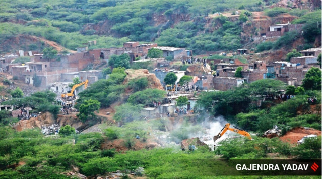 Structures being razed at Khori village. (Express Photo by GajendraYadav)
