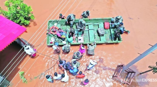 Army and NDRF teams evacuate residents from flood-affected areas on Sunday.  (Express Photo)