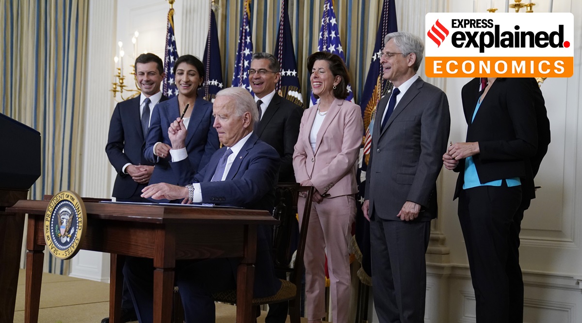President Joe Biden hands out a pen after signing an executive order aimed at promoting competition in the economy, in the State Dining Room of the White House, Friday, July 9, 2021, in Washington. (AP Photo/Evan Vucci)