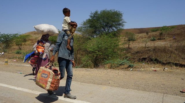 Migrant labourers at the Gujarat MP border to return home during lockdown due to Covid-19 pandemic. (Express File Photo By Bhupendra Rana)
