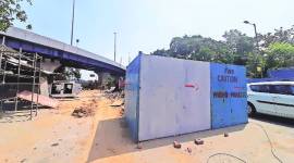 Work on pedestrian subway behind traffic at Dilli Haat