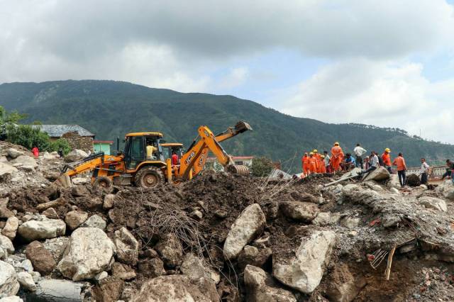 Kangra: Restoration work underway at village Boh after a landslide triggered by a cloudburst, in Kangra district, Wednesday, July 14, 2021. (PTI Photo)