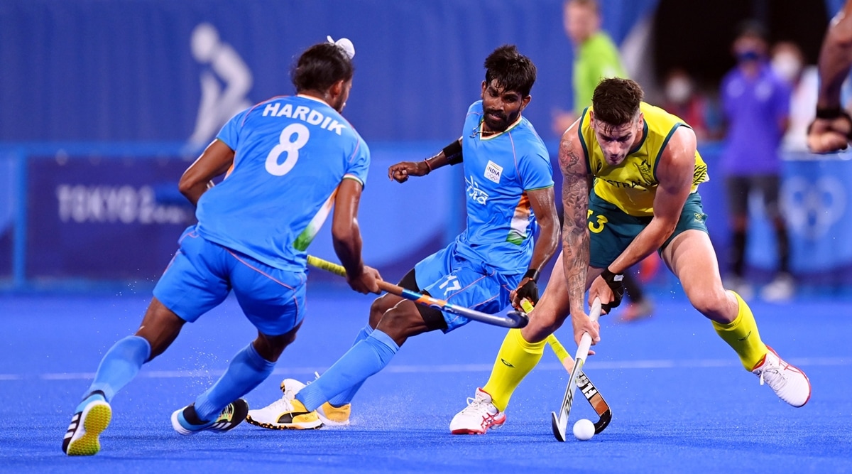 India and Australia players tussle for possession during their 2021 Tokyo Olympics match. (Twitter/Hockey India)