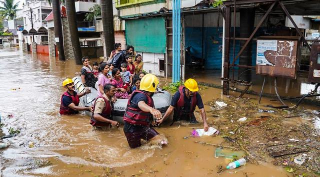 Municipal Corporation firefighters during a rescue operation after heavy rain in Kolhapur, Thursday, July 22, 2021. (PTI Photo)