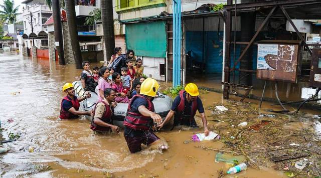Municipal Corporation firefighters during a rescue operation after heavy rain in Kolhapur, Thursday, July 22, 2021. (PTI Photo)