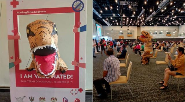 malaysia man dinosaur suit vaccination, dinosaur gets vaccinated, vaccination odd outfits, covid vaccine, viral news, funny news, indian express