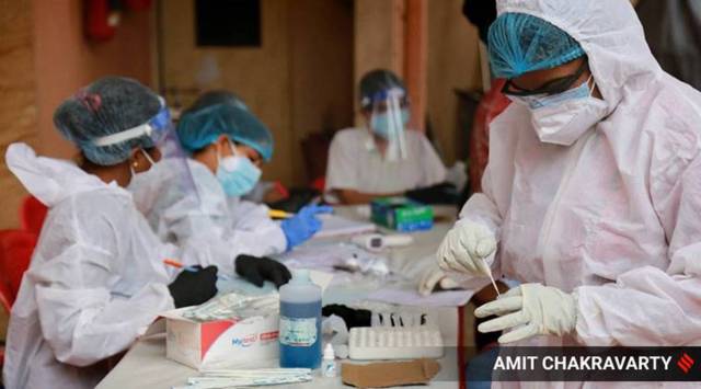 Testing of residents at Giriraj Housing Society in Seawoods, Navi Mumbai. (Express photo by Amit Chakravarty)