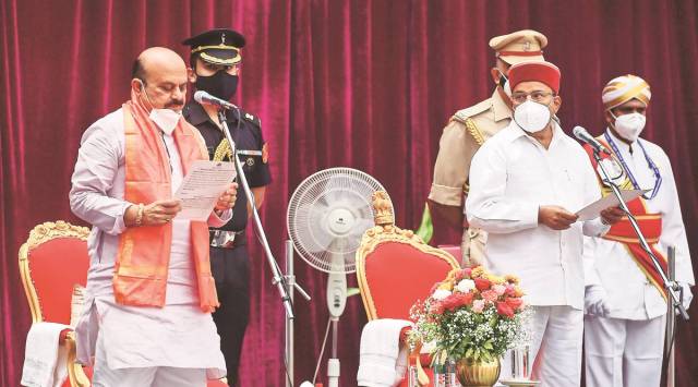 Karnataka Governor Thawarchand Gehlot administers the oath of office to new Karnataka Chief Minister Basavaraj Bommai, at a ceremony at Raj Bhavan, in Bengaluru. (PTI)