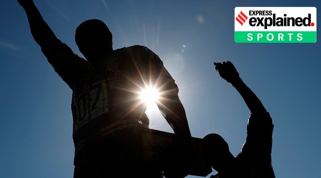 A statue in honour of former Olympians Tommie Smith, left, and John Carlos is seen on the campus of San Jose State University in San Jose, Calif.  Smith and Carlos raised their black-gloved fists while their national anthem played during the 200-meters medals ceremony at the Mexico City Olympics in 1968. (AP Photo/Tony Avelar, File)