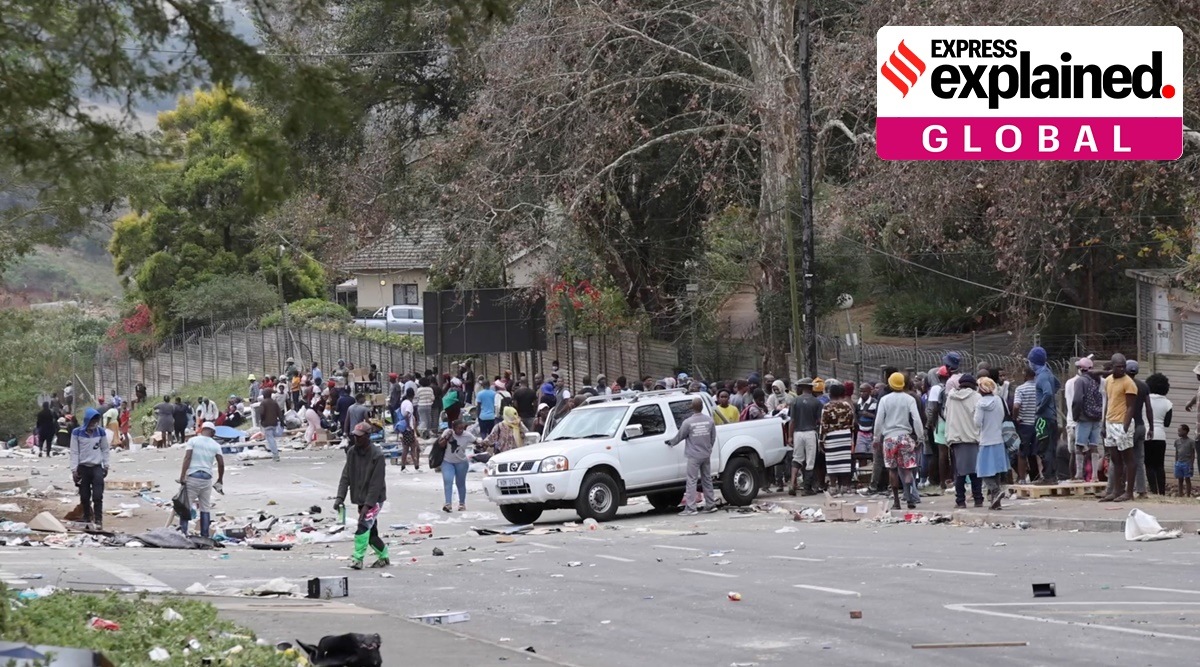 People stand on the roadside after being evicted following protests that have widened into looting, in Durban, South Africa July 13, 2021. (Reuters)