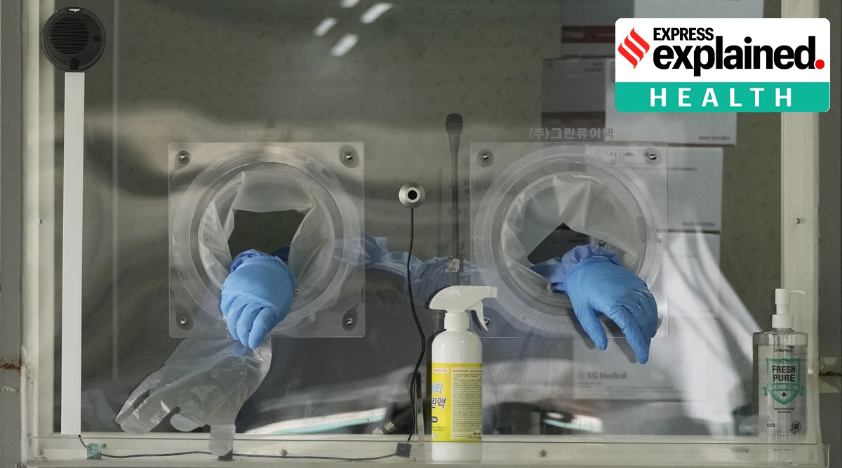 An exhausted worker in a booth rests during Covid-19 testing at a site in Seoul, South Korea, Tuesday, July 6, 2021. (AP Photo/Ahn Young-joon, File)