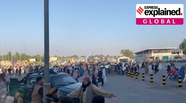A horde of people run towards the Kabul Airport Terminal, after Taliban insurgents took control of the presidential palace in Kabul (Reuters)