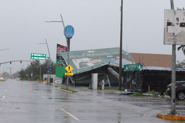 An advertising structure felled by wind is pictured in a street as Hurricane Nora barrels towards southwest coast of Mexico, in Manzanillo, in Colima state, Mexico | Reuters