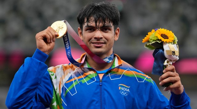 Gold medalist Neeraj Chopra, of India, poses during the medal ceremony for the men's javelin throw at the 2020 Summer Olympics, Saturday, Aug. 7, 2021, in Tokyo | AP