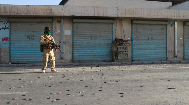 Afghan security personnel take a position during fighting between Taliban and Afghan security forces in Herat province, west of Kabul. (File)