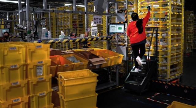An Amazon employee sorts items at the company's facility on Staten Island in New York on March 2, 2021. (Chang W. Lee/The New York Times)