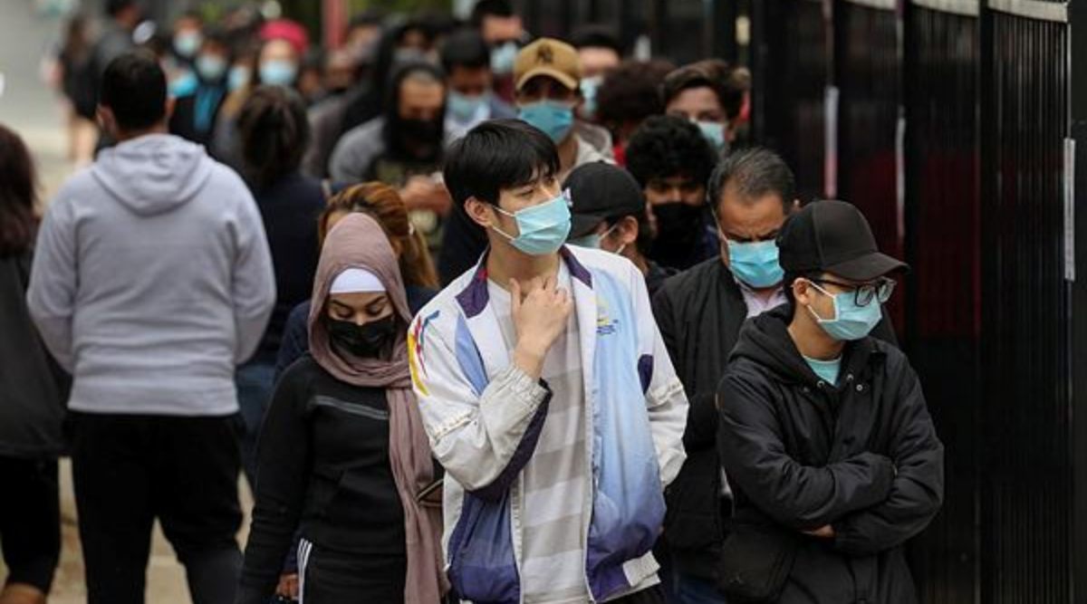 People wait in line outside a coronavirus disease (COVID-19) vaccination clinic in the Bankstown suburb during a lockdown to curb an outbreak of cases in Sydney, Australia, August 25, 2021. (Reuters)