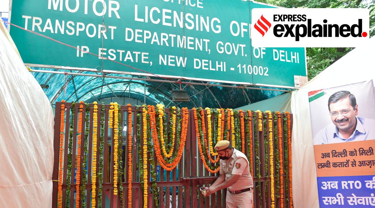 A policeman locks the MLO office of Transport department at the launch of faceless facility at Delhi Transport department, in New Delhi, Wednesday, Aug 11, 2021. Earlier, Chief Minister Arvind Kejriwal locked the same for a symbolic representation. (PTI Photo)