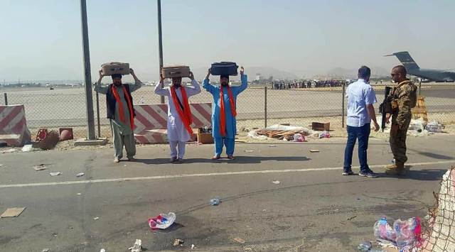 The Guru Granth Sahib being taken to the Indian Air Force aircraft, in Kabul on Monday. (ANI)