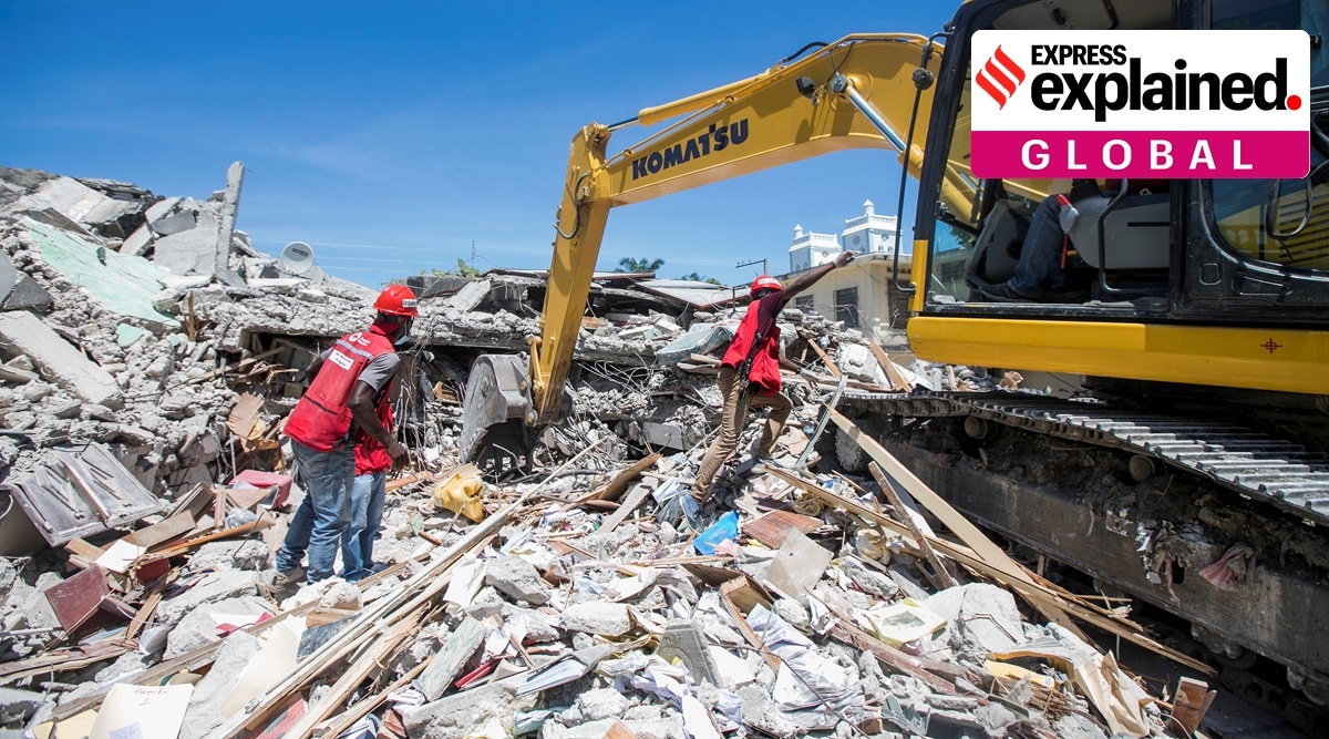 Members of a rescue and protection team clean debris from a house after a 7.2 magnitude earthquake in Les Cayes, Haiti. (REUTERS/Ralph Tedy) 
