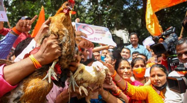 Shiv Sena workers protest against Narayan Rane at Goodluck chowk in Pune's Deccan area. (Express photo by Ashish Kale)