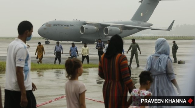 Evacuees from Afghanistan at the Hindon IAF base in Ghaziabad. (Express photo by Praveen Khanna)
