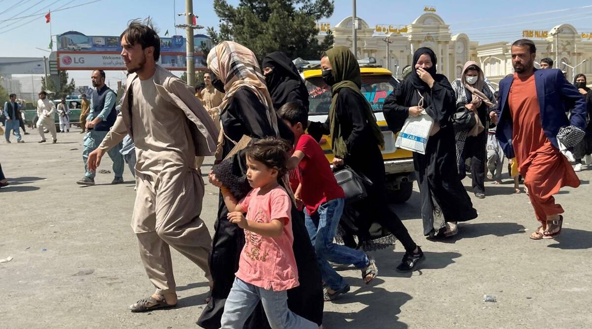 People try to get into Hamid Karzai International Airport in Kabul, Afghanistan. (Reuters)