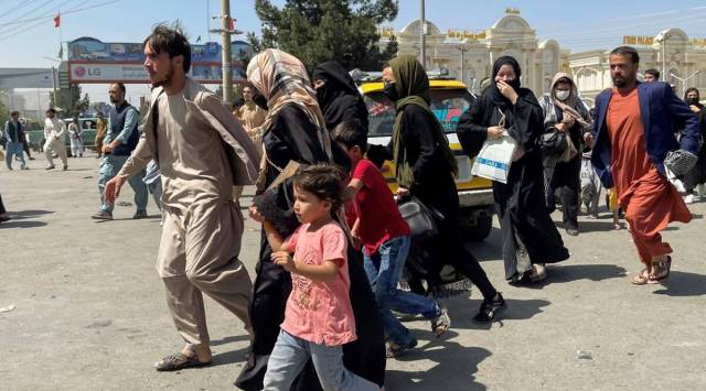 People try to get into Hamid Karzai International Airport in Kabul, Afghanistan. (Reuters)