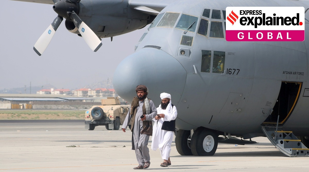 Taliban walk in front of a military airplane a day after the US troops withdrawal from Hamid Karzai international airport n Kabul, Afghanistan August 31, 2021. (Reuters)