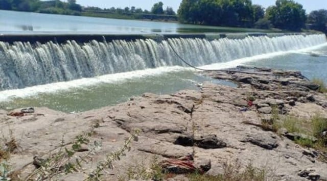 A check-dam across Aji river in Kalipat village upstream the Aji-I dam overflows after Narmada water was pumped into the river through SAUNI link-I. (Express Photo)