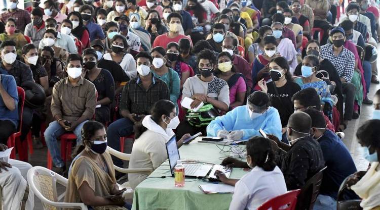 People wait to get vaccinated at a centre in in Thiruvananthapuram (File/PTI)