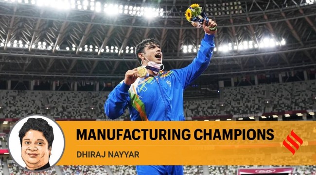 Gold medalist Neeraj Chopra poses during the medal ceremony for the men's javelin throw at the 2020 Summer Olympics in Tokyo. (AP/PTI Photo)