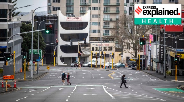 People cross nearly empty streets in the central business district of Auckland, New Zealand, Friday Aug. 27, 2021. (AP Photo)