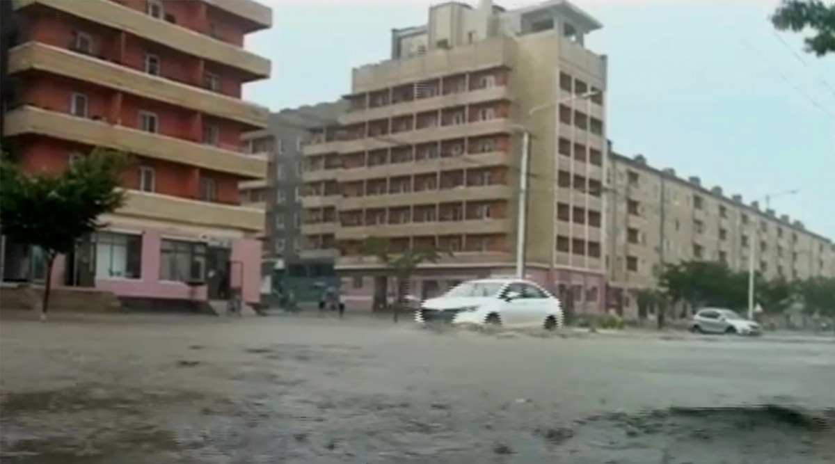In this image taken from undated North Korean state broadcaster video, vehicles pass through flooded streets after heavy rains across  South Hamgyong Province, North Korea. (KRT via APTV)