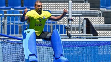 Sreejesh sits on the goal-post while celebrating their victory over Germany in the men's field hockey bronze medal match, at the 2020 Summer Olympics, in Tokyo. (Photo: PTI)