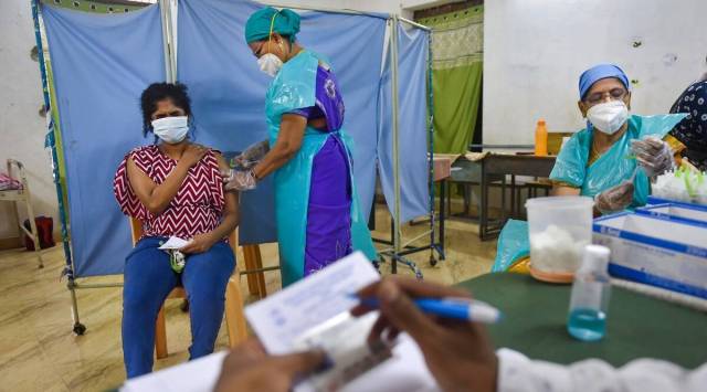 A health worker administers a dose of a Covid-19 vaccine in Chennai. (PTI)