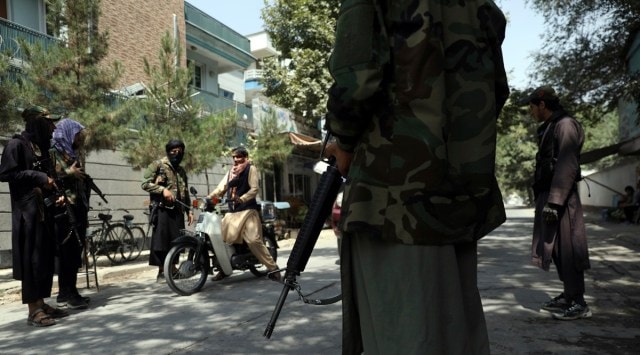 Taliban fighters stand guard at a checkpoint in the Wazir Akbar Khan neighborhood in the city of Kabul, Afghanistan. (AP Photo)