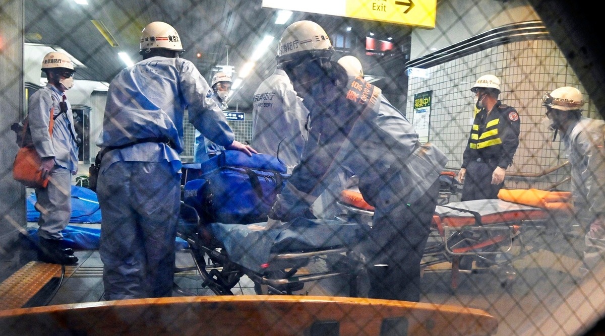 Rescuers prepare stretchers at Soshigaya Okura Station after stabbing on a commuter train, in Tokyo Friday, Aug. 6, 2021. (AP)