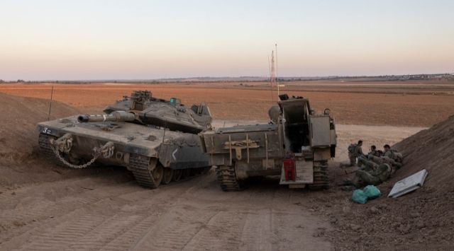 Israeli soldiers are positioned near the Israel-Gaza border. (AP Photo/Tsafrir Abayov)

