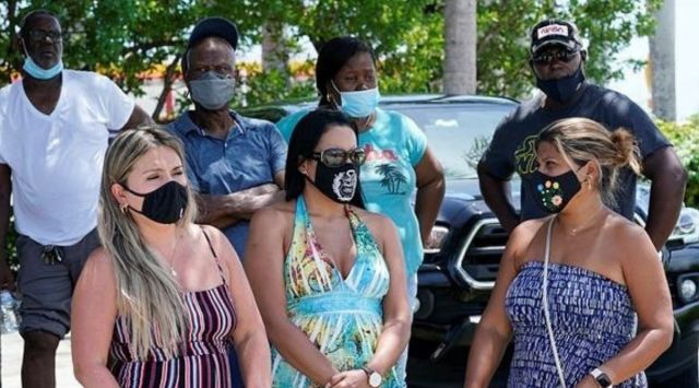A group waits to get a Covid-19 test, Saturday, July 31, 2021, in North Miami, Florida. Federal health officials say Florida has reported 21,683 new cases of Covid-19. (AP)
