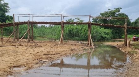 The makeshift bridge over the Badanala, one of two streams separating residents from the outside world, will now save them an 8-km hike through a forest. 