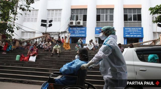 Outside a Kolkata hospital, Tuesday. (Express Photo by Partha Paul)